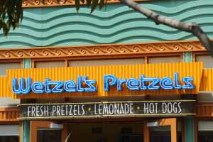 The smell wafts from Wetzel's pretzels around the midsection of Downtown Disney, also a good snack option!