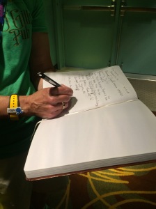 Signing the guest book.